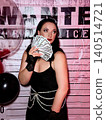 Woman holding money playing mafia criminal game 140514721