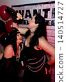 Women celebrating a themed party with champagne 140514727
