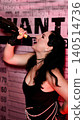 Woman drinking champagne vintage style with wanted poster 140514736