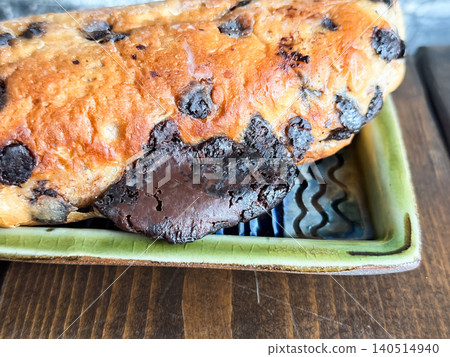 Babka, a sweet bread with lots of chocolate kneaded into it. A close-up of the chocolate spilling out. Babka, a sweet bread with lots of chocolate kneaded into it. A close-up of the chocolate spilling out. 140514940