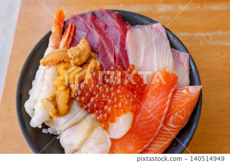 A seafood rice bowl lavishly topped with the finest seafood from Hokkaido. A seafood rice bowl lavishly topped with the finest seafood from Hokkaido. 140514949