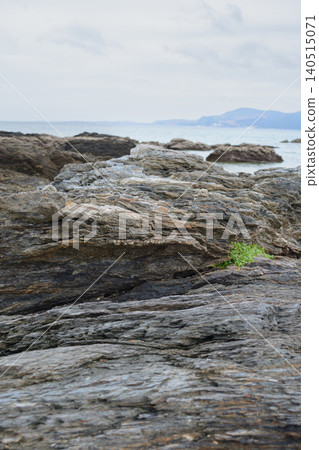 Rocky reefs and copy space on the coast of Okinawa under a cloudy sky Rocky reefs and copy space on the coast of Okinawa under a cloudy sky 140515071