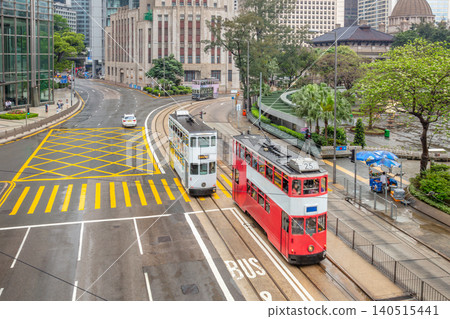 Double-Decker Trams at a Hong Kong City Intersection Double-Decker Trams at a Hong Kong City Intersection 140515441