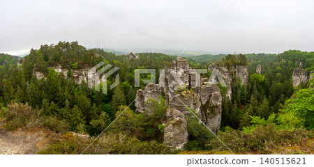 Rock city formations in Hruboskalsko, Bohemian Paradise (Cesky raj), Czech Republic, with peaks of giant sandstone rocks and cliffs emerging from light morning mist panoramic view Rock city formations in Hruboskalsko, Bohemian Paradise (Cesky raj), Czech Republic, with peaks of giant sandstone rocks and cliffs emerging from light morning mist panoramic view 140515621