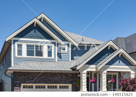 Real Estate Exterior Front low rise House with windows and rooftop. Facade of luxury residential family house on a sunny summer day. Nobody 140515825