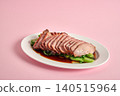 Tender char siu pork glazed with a sticky sweet sauce and slightly charred 140515964