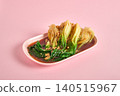 Cabbage with oyster sauce and garlic on a plate on a pink background 140515967