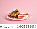 Thai Gai Yang grilled chicken, sliced and served with spicy dipping sauce and fresh cilantro. 140515968