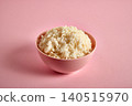 Bowl of tasty white rice boiled on pink 140515970
