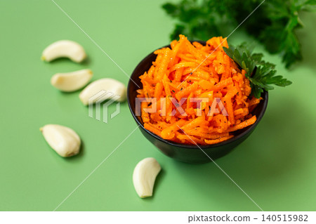 Traditional Korean carrot salad with fresh parsley garnish Traditional Korean carrot salad with fresh parsley garnish 140515982