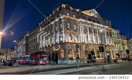 London's illuminated historical buildings and red buses 140516432