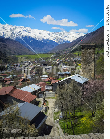 Mestia village in the Upper Svaneti region, Georgia. Snow-capped peaks overlook a tranquil village Mestia village in the Upper Svaneti region, Georgia. Snow-capped peaks overlook a tranquil village 140516566