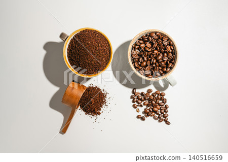 Roasted coffee beans and ground coffee in cups on white background, flat lay with copy space 140516659