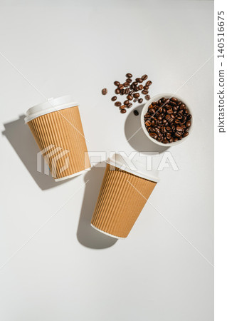 Roasted Coffee Beans and Takeaway Coffee Cups with on Light Background and soft shadows. Flat lay, top view 140516675