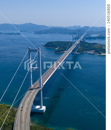 A vertical aerial photograph showing the Kurushima Kaikyo Bridge and the islands of the Seto Inland Sea. A vertical aerial photograph showing the Kurushima Kaikyo Bridge and the islands of the Seto Inland Sea. 140516808