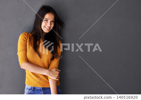 Portrait, female model and sweater in studio, fashion or cool style in gray background. Woman, smile and happy with confidence or pride in mockup space, stylish and edgy in casual outfit or clothes Portrait, female model and sweater in studio, fashion or cool style in gray background. Woman, smile and happy with confidence or pride in mockup space, stylish and edgy in casual outfit or clothes 140516920