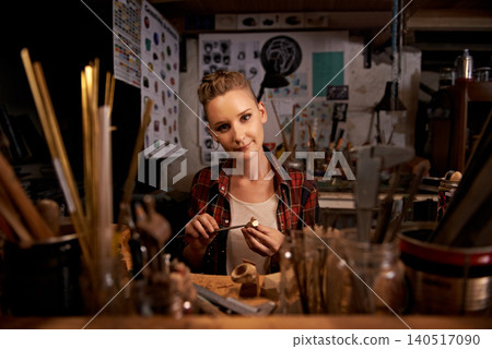 Portrait, woman and tools with wood in workshop with craftsmanship, knife or handmade design and creativity. Woodwork, carpenter or creative person at workspace with equipment for handicraft or hobby 140517090