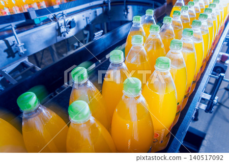 Beverage factory interior. Conveyor with bottles for juice or water. Equipments Beverage factory interior. Conveyor with bottles for juice or water. Equipments 140517092