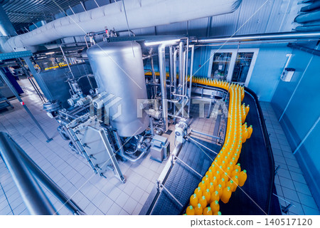 Beverage factory interior. Conveyor with bottles for juice or water. Equipments 140517120