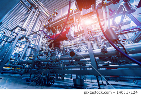 Modern interior of a brewery. Barrels and pipes. Factory interior. Modern interior of a brewery. Barrels and pipes. Factory interior. 140517124
