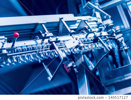 Automatic filling machine pours water into plastic PET bottles. Brewing production. Automatic filling machine pours water into plastic PET bottles. Brewing production. 140517127