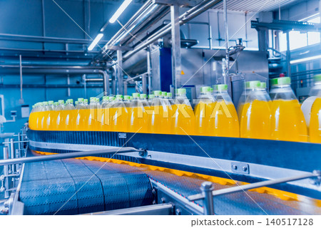 Beverage factory interior. Conveyor with bottles for juice or water. Equipments Beverage factory interior. Conveyor with bottles for juice or water. Equipments 140517128