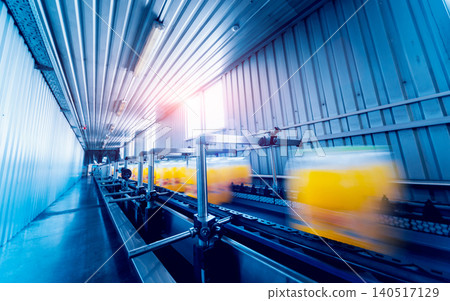 Strapping machine for packaging line. Modern machine for packaging line in factory. Technology and industrial concept. Strapping machine for packaging line. Modern machine for packaging line in factory. Technology and industrial concept. 140517129