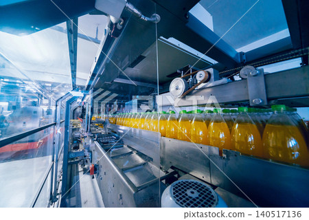 Beverage factory interior. Conveyor with bottles for juice or water. Equipments Beverage factory interior. Conveyor with bottles for juice or water. Equipments 140517136