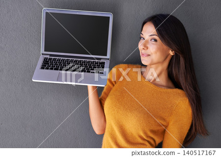 Woman, portrait and laptop screen in studio, blank and mockup space for website or app. Female person, promotion and empty display for marketing or advertising, social media and gray background Woman, portrait and laptop screen in studio, blank and mockup space for website or app. Female person, promotion and empty display for marketing or advertising, social media and gray background 140517167