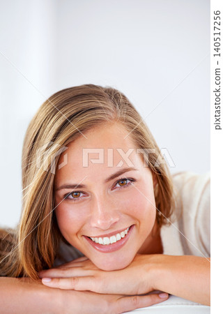 Happy, woman and relax in portrait with beauty or natural makeup in home or white background. Girl, smile and model with pride, confidence and glow on face from skincare, dermatology or cosmetics Happy, woman and relax in portrait with beauty or natural makeup in home or white background. Girl, smile and model with pride, confidence and glow on face from skincare, dermatology or cosmetics 140517256