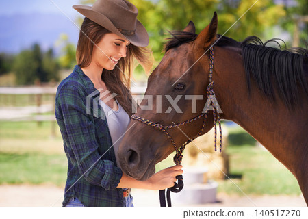 Cowgirl, smile and woman with horse at farm outdoor in summer or nature in Texas for recreation. Western, happy female person and animal at ranch, pet or stallion in the rural countryside together Cowgirl, smile and woman with horse at farm outdoor in summer or nature in Texas for recreation. Western, happy female person and animal at ranch, pet or stallion in the rural countryside together 140517270