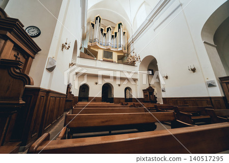 Interior view of a old church with empty pews 140517295