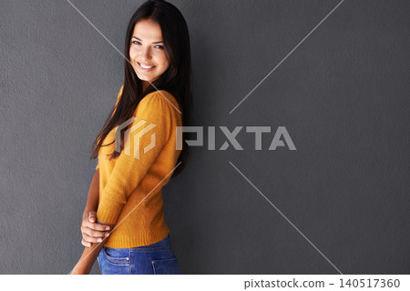 Mockup space, fashion and female model in studio, portrait and cool or trendy style in gray background. Woman, smile and happy with confidence or pride, stylish or edgy in casual outfit or clothes Mockup space, fashion and female model in studio, portrait and cool or trendy style in gray background. Woman, smile and happy with confidence or pride, stylish or edgy in casual outfit or clothes 140517360