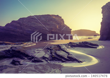 Rocky sea coast at sunrise. Playa de Las Catedrales, Ribadeo, Spain, Europe Rocky sea coast at sunrise. Playa de Las Catedrales, Ribadeo, Spain, Europe 140517478