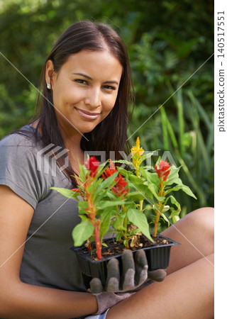 Woman, portrait with flowers and garden in backyard, nature and sustainability with environment. Landscaping, gardener with plant in soil or fertilizer for growth, eco friendly and botanical outdoor Woman, portrait with flowers and garden in backyard, nature and sustainability with environment. Landscaping, gardener with plant in soil or fertilizer for growth, eco friendly and botanical outdoor 140517551