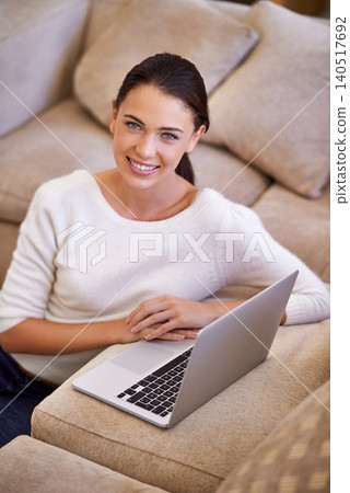 Woman, portrait and laptop for remote work on internet, home and smile for copywriting or blog. Female person, living room and happy for website research for article, information and app on tech 140517692