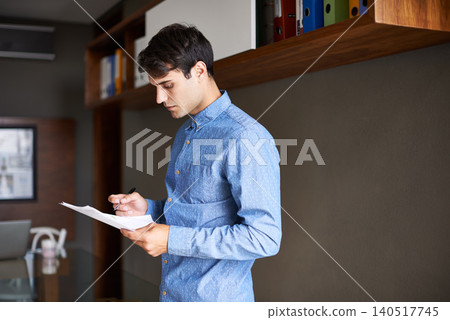 Reading, paperwork and business man in office for proposal, project review and company report. Professional, consultant and person with documents for information, research and planning in workplace Reading, paperwork and business man in office for proposal, project review and company report. Professional, consultant and person with documents for information, research and planning in workplace 140517745