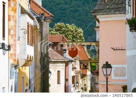Colorful street in Krems, Austria with historic architecture and green hills Colorful street in Krems, Austria with historic architecture and green hills 140517865