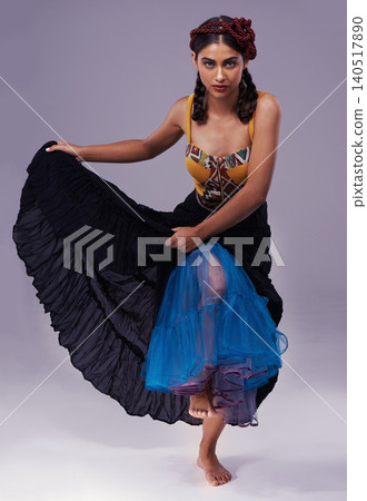 Portrait, flamenco or woman in dress to dance with energy, freedom or fashion for Spanish style. Creative, purple background or artist in studio, tango or performance in musical culture or tradition 140517890