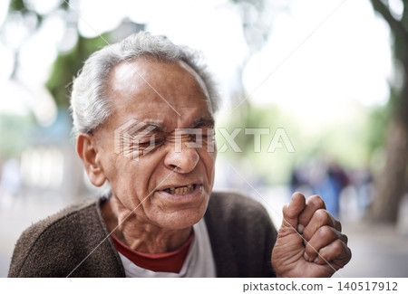 Face, sick and old man sneezing in a street or city in retirement, neighborhood and town. Sao Paulo, flu illness and elderly male person with hay fever, hardship and wisdom in outdoor area and Brazil Face, sick and old man sneezing in a street or city in retirement, neighborhood and town. Sao Paulo, flu illness and elderly male person with hay fever, hardship and wisdom in outdoor area and Brazil 140517912