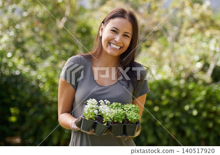 Portrait, smile and excited woman in a garden with plant, sprout or leaf growth outdoor. Backyard, sustainability and face of female person gardening outside for lawn, grass or asylum seedling soil 140517920