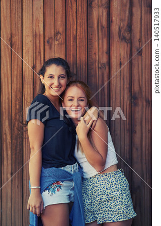 Portrait, smile and woman friends on wooden background together for bonding or relationship. Love, funny or laughing and happy young people having fun with fashion in summer for holiday and vacation Portrait, smile and woman friends on wooden background together for bonding or relationship. Love, funny or laughing and happy young people having fun with fashion in summer for holiday and vacation 140517933