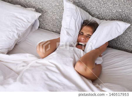 Woman, noise or insomnia in bedroom to rest, tired or cover ears with pillow for crisis of loud background. Lady, frustrated and mad for sound or sleep problem, anxiety and headache or stress in home Woman, noise or insomnia in bedroom to rest, tired or cover ears with pillow for crisis of loud background. Lady, frustrated and mad for sound or sleep problem, anxiety and headache or stress in home 140517953