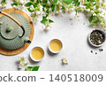 Green jasmine tea and flowers 140518009