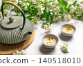 Green jasmine tea and flowers 140518010