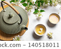 Green jasmine tea and flowers 140518011