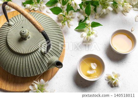 Green jasmine tea and flowers 140518011