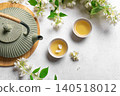 Green jasmine tea and flowers 140518012