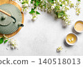 Green jasmine tea and flowers 140518013