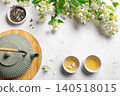 Green jasmine tea and flowers 140518015